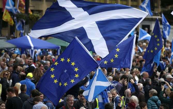 Thousands of people take part in the 'All Under One Banner' march for Scottish independence through Glasgow city centre, Scotland, Saturday, July 30, 2016. A new poll has found 